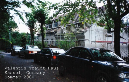 The Valentin Traudt Haus in Kassel, Germany underwent rennovation. A row cars parked alongside the house.